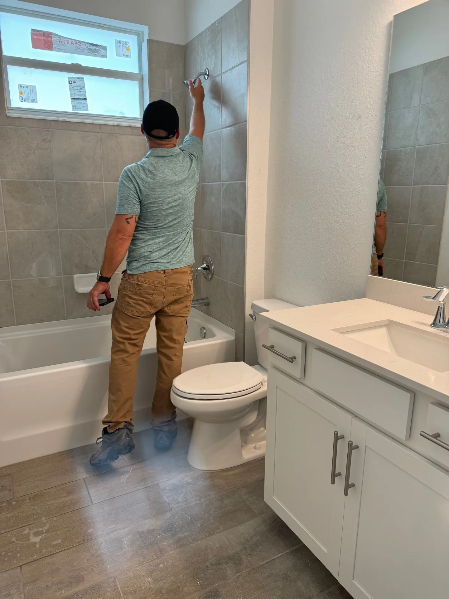 Tim-inspectng-shower-head
