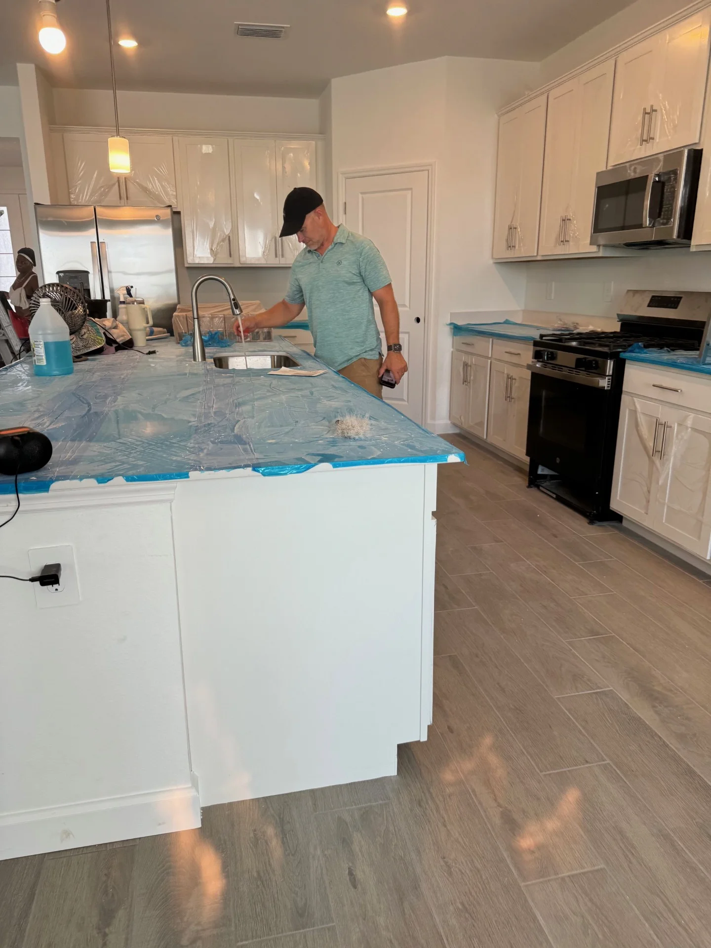 Tim-inspectng-shower-kitchen-sink